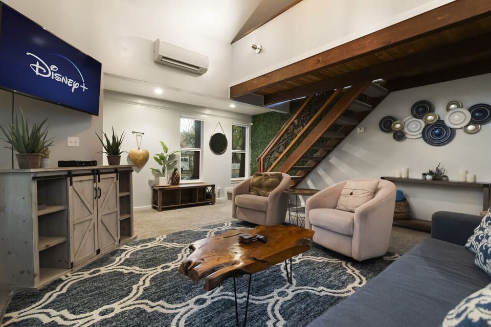 Comfortable living area with ample seating and entertainment setup.