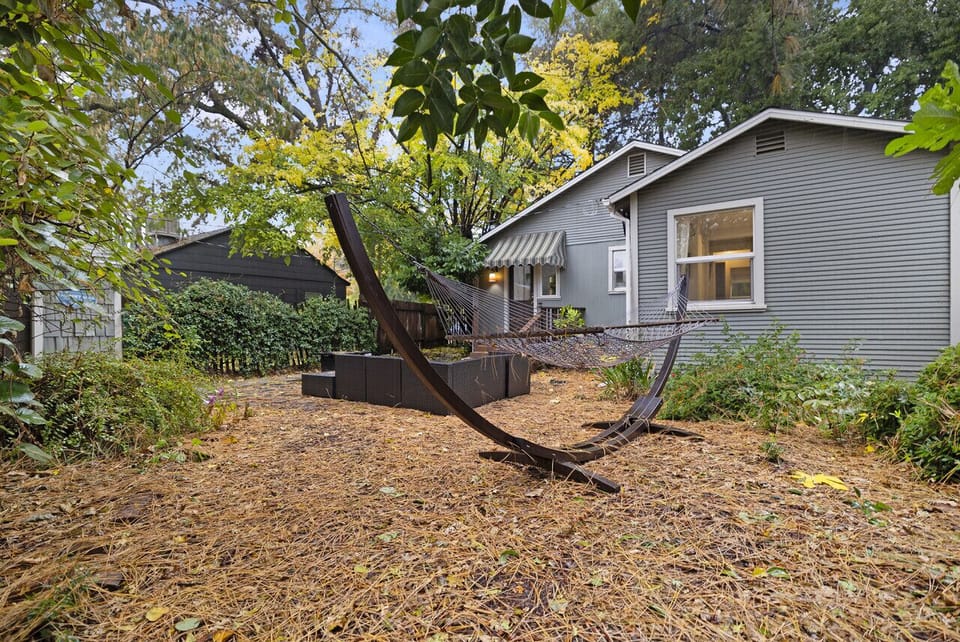 Large backyard with open space and natural surroundings