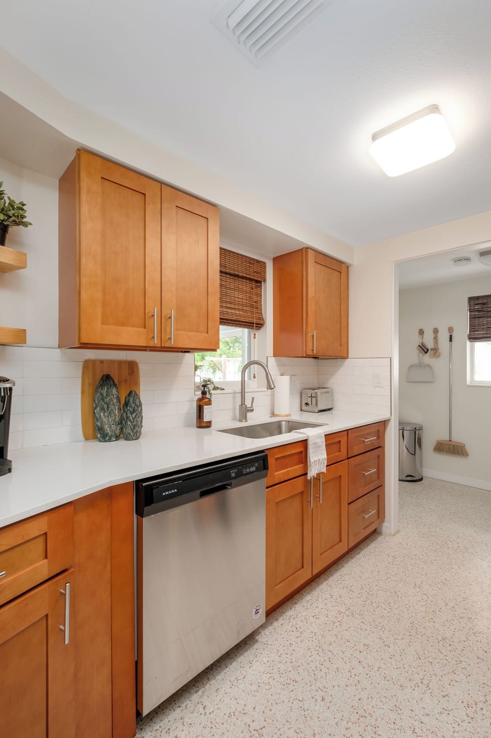 Kitchen is newly renovated with shaker cabinets and stainless steel appliances