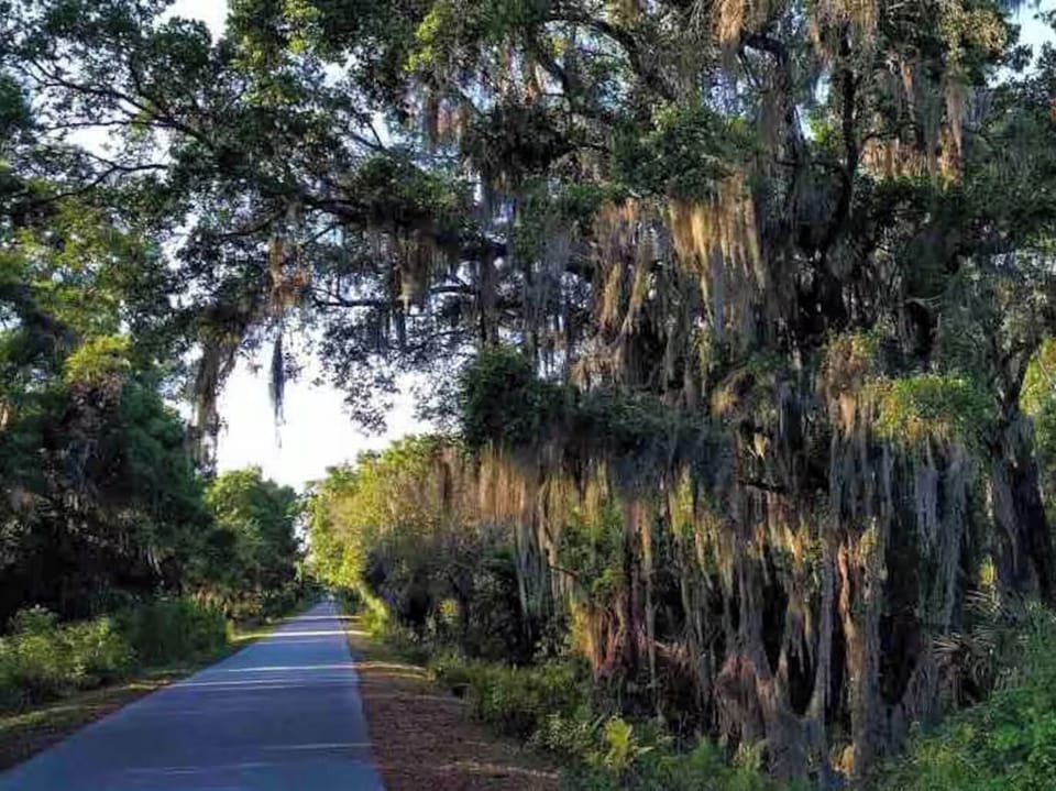 Less than a mile from a 15-mile biking/walking Legacy Trail trailhead