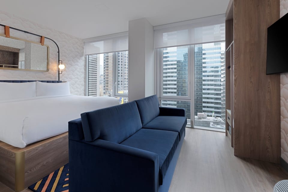 Suite, 1 Bedroom (Times Square View) | In-room safe, blackout drapes, free WiFi, bed sheets