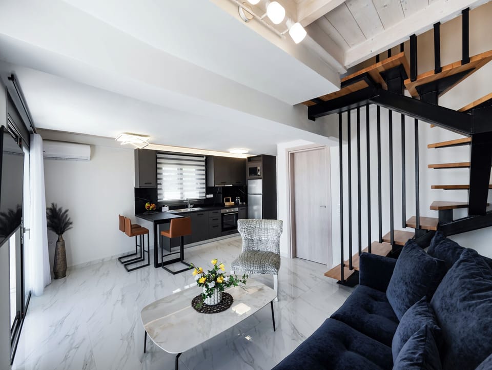 Deluxe Duplex, Sea View | Living area | TV