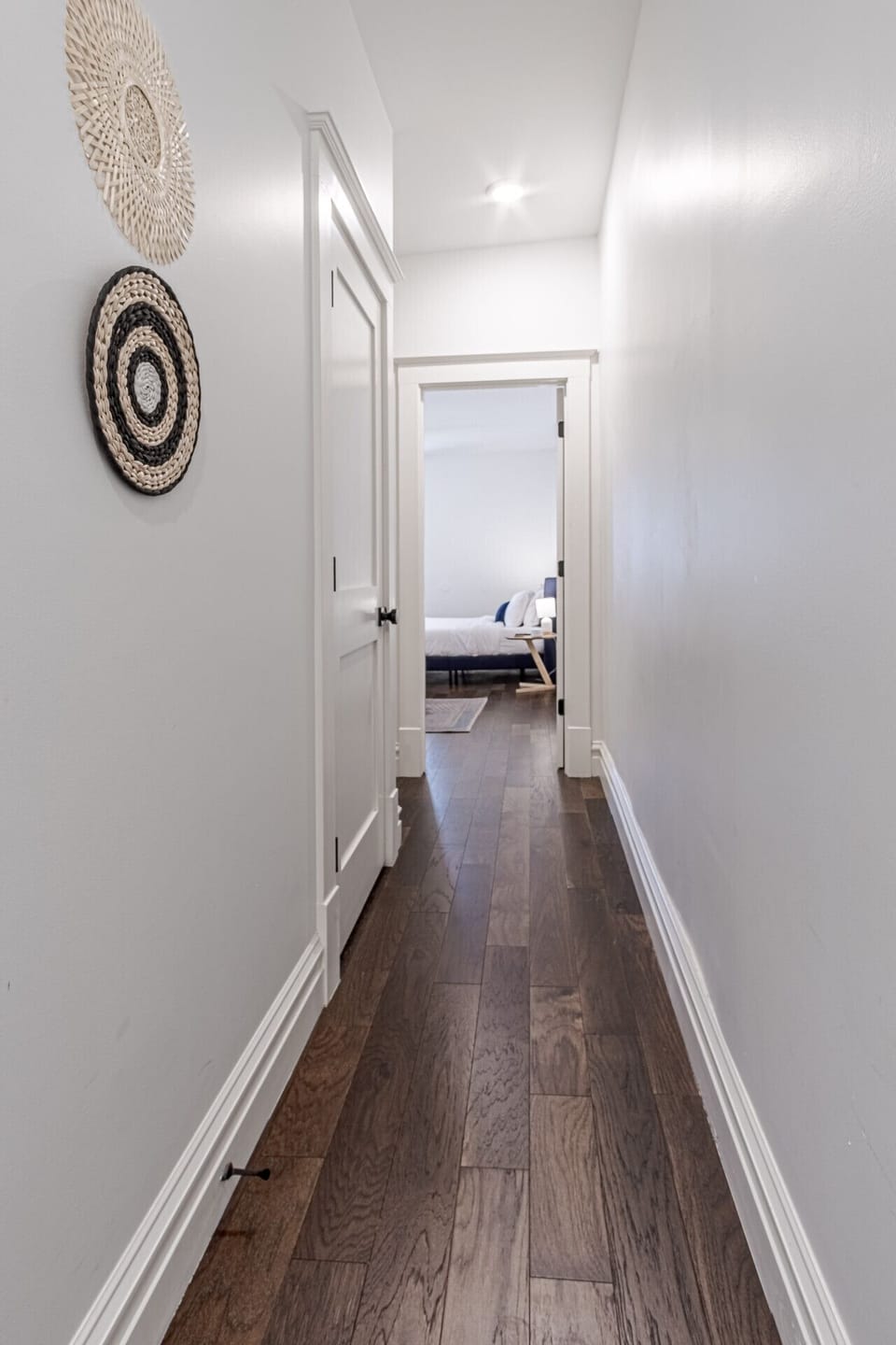 This well-lit hallway provides a smooth, inviting passage to the master bedroom, setting the tone for a tranquil and restful stay.