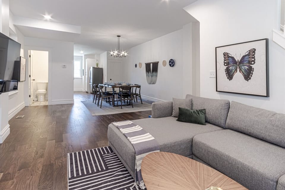 Inviting Living Room with stylish seating and a sleek dining area create the perfect backdrop for gatherings!