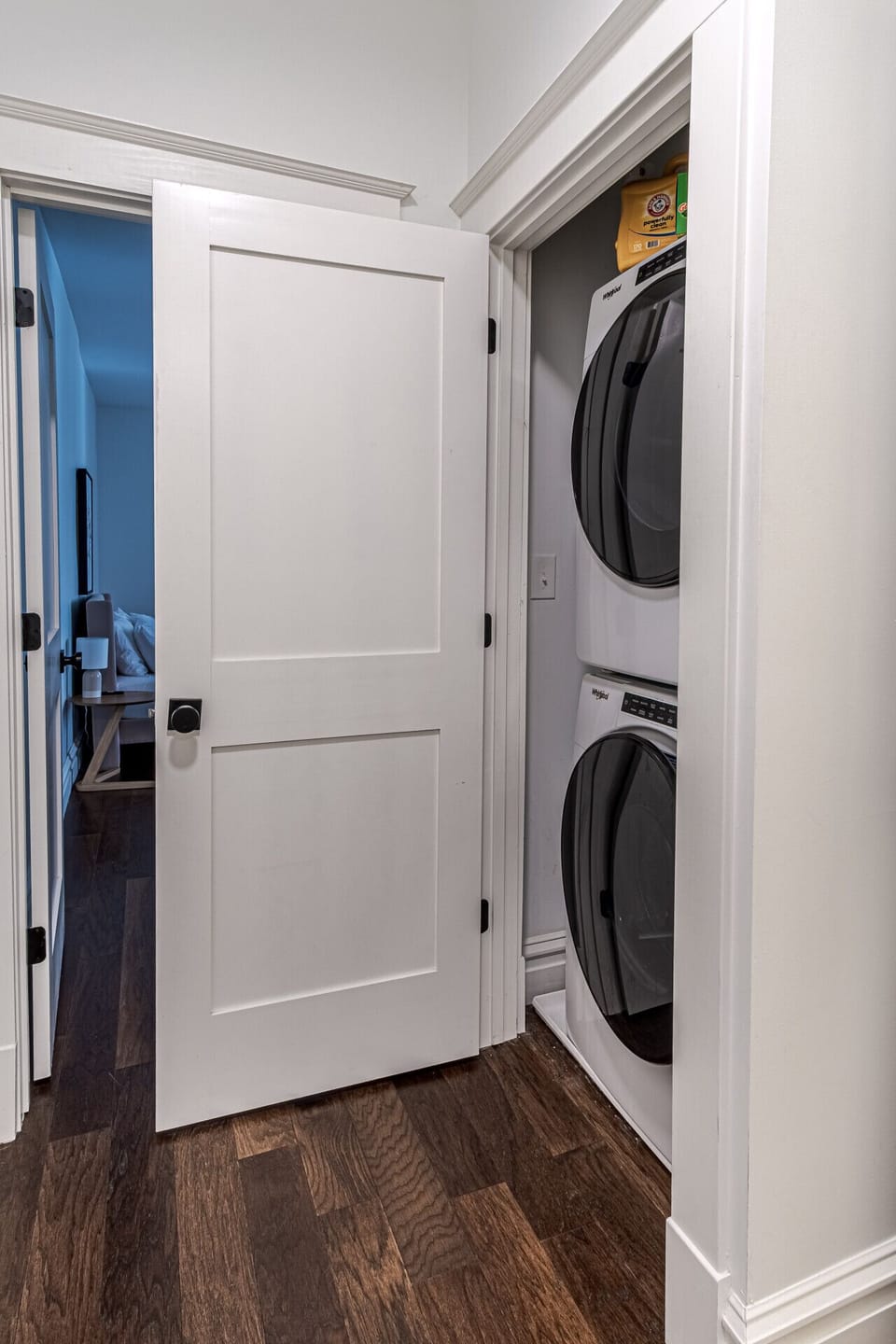 In-Unit Laundry Room: Keep your wardrobe fresh throughout your stay with this high-capacity, stacked front-loading washer and dryer set neatly tucked into a dedicated utility closet. Situated right off the main guest hallway, this essential in-unit laundr