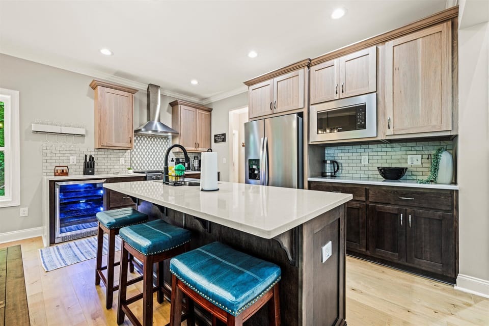 Fully equipped kitchen with island seating and stainless appliances
