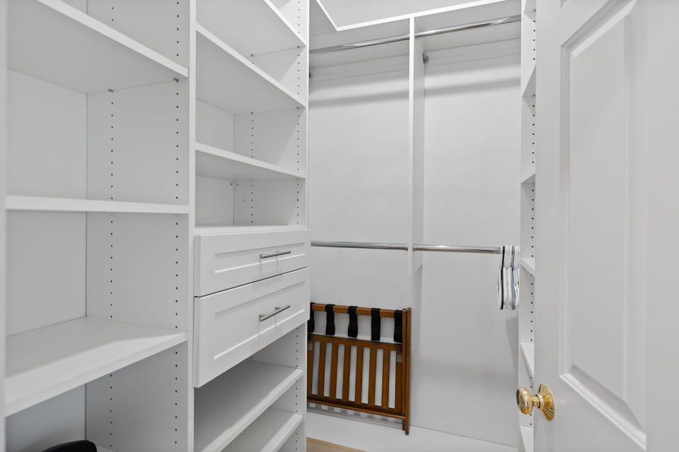 Spacious walk-in closet directly connected to the master bedroom