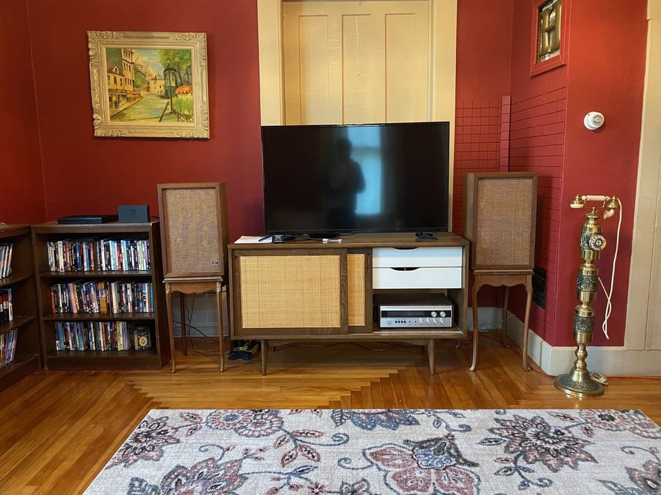 Main Living Room - Stereo Sound System, Aux Cord for Listening to Music, DVD Collection and Player