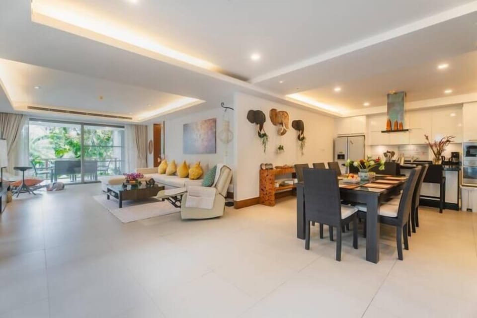 Open-plan dining and living area with bright, airy layout.