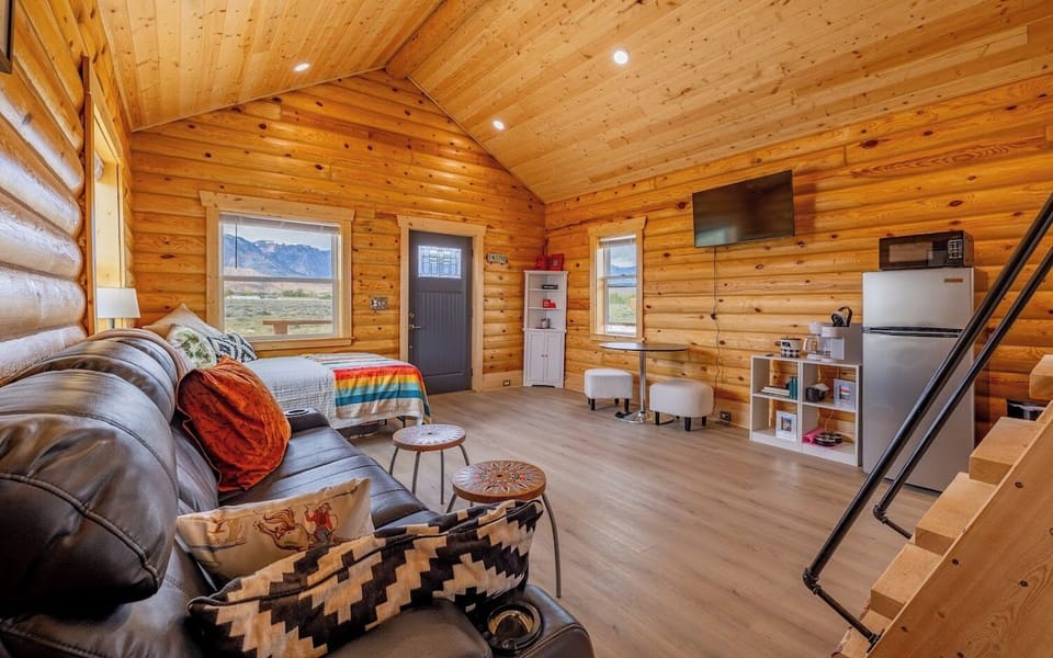 The Little Bear Cabin has a smart tv, coffee bar with a Keurig and regular drip style coffee maker and dining space.