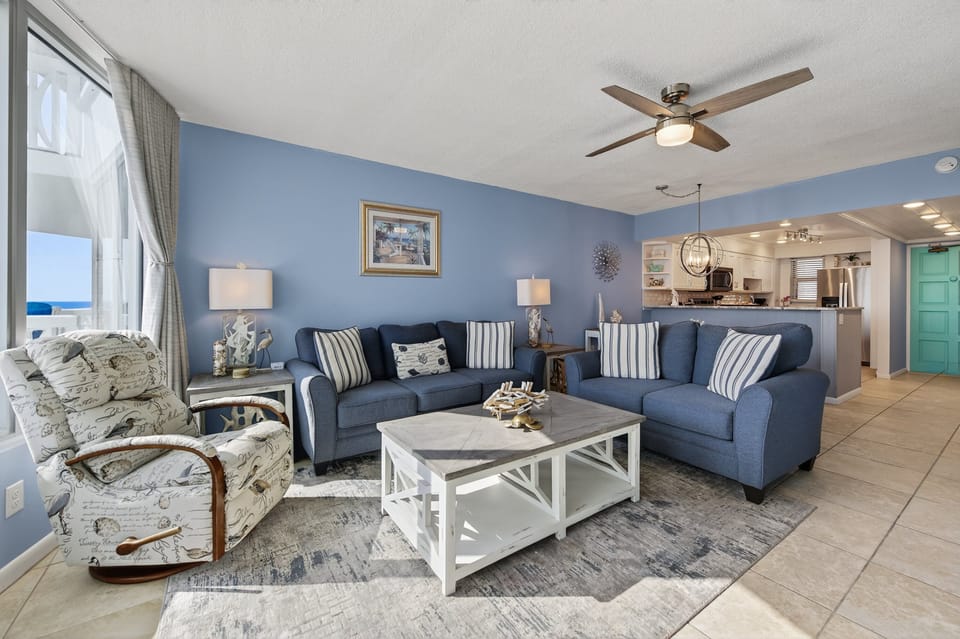 Cozy up in the coastal-chic living room, where ocean views meet total comfort.