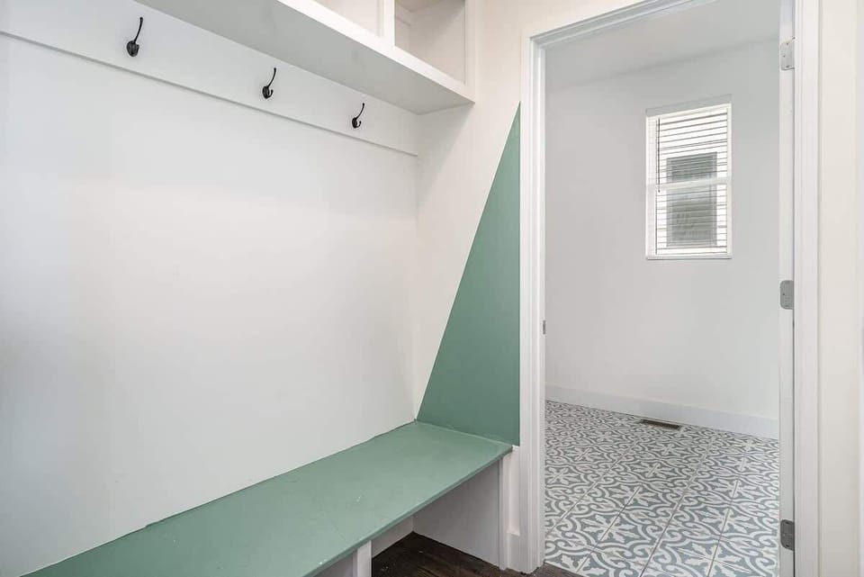 Thoughtfully designed mudroom keeps your entryway organized and clutter-free. (1st Floor)