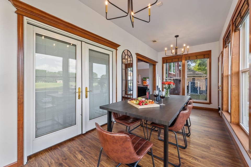 Gather around this stylish dining table flooded with natural light—perfect for sharing laughs, good food, and a glass of wine while enjoying peaceful views just outside the window.