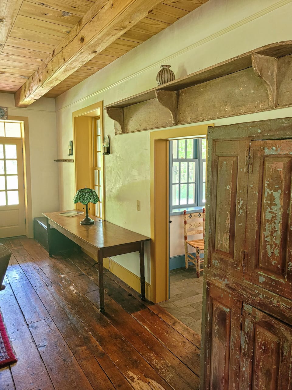 Rustic wood floors and details throughout the farmhouse