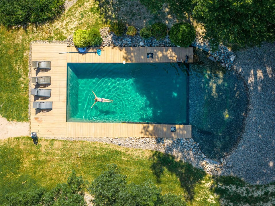 Outdoor areas: 10x5 saltwater swimming pool with natural beach; Large park with century-old trees; Terrace with table and chairs; Gas plancha grill; Green charging station.