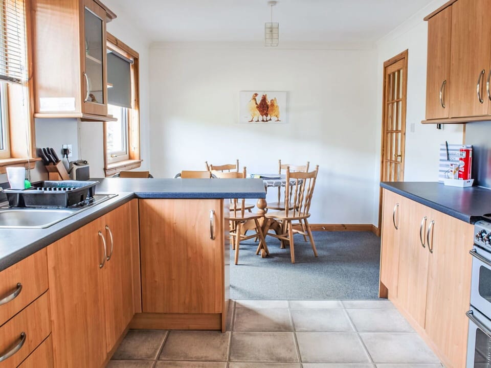 Furniture, Wood, Flooring, Interior Design, Cabinetry, Kitchen, Floor, Countertop, Room, Ceiling