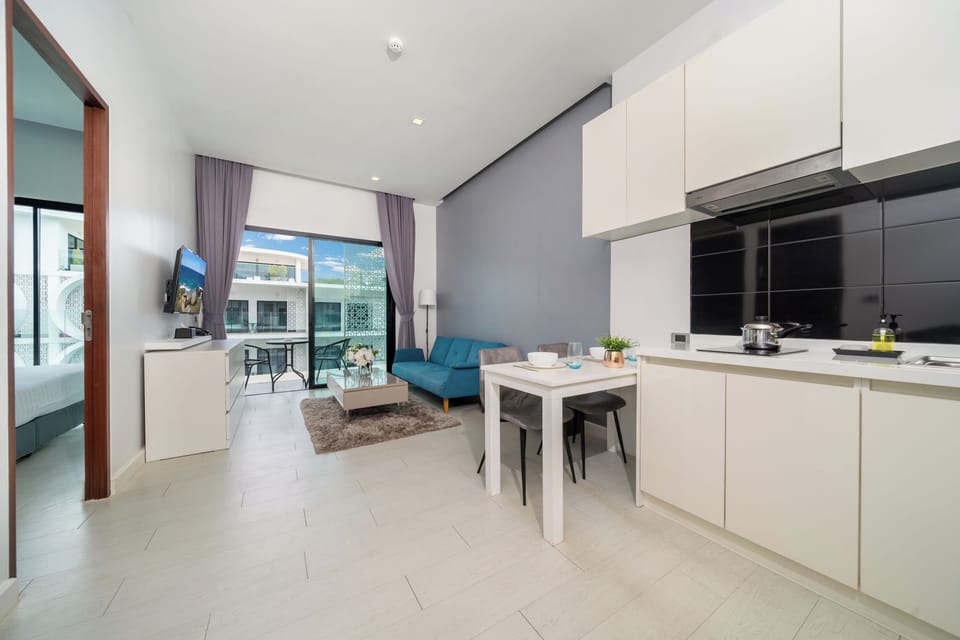 Exclusive Condo, 1 Bedroom, Balcony, Pool View | Living area | 46-inch flat-screen TV with cable channels