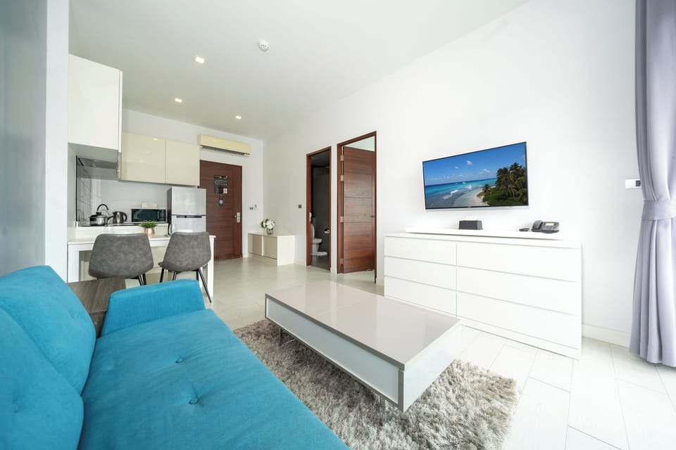 Exclusive Condo, 1 Bedroom, Balcony, Pool View | Living area | 46-inch flat-screen TV with cable channels
