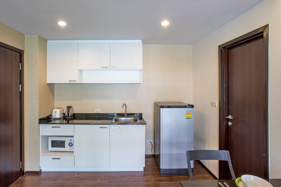 Family Condo, 1 Bedroom, Balcony, Pool View | Private kitchenette | Electric kettle