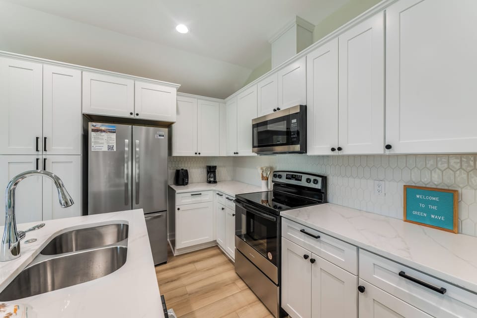 Your fully equipped kitchen awaits with modern appliances, granite counters, and everything needed for memorable meals.