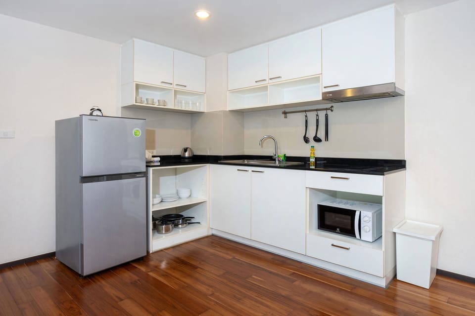 Family Condo, 1 Bedroom, Balcony, Garden View | Private kitchen | Electric kettle