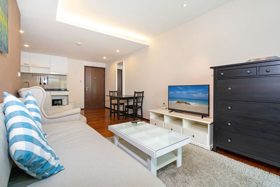 Family Condo, 1 Bedroom, Balcony, Garden View | Living area | 36-inch flat-screen TV with cable channels