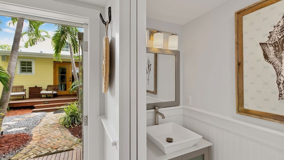 The Guest House has a half bath inside...