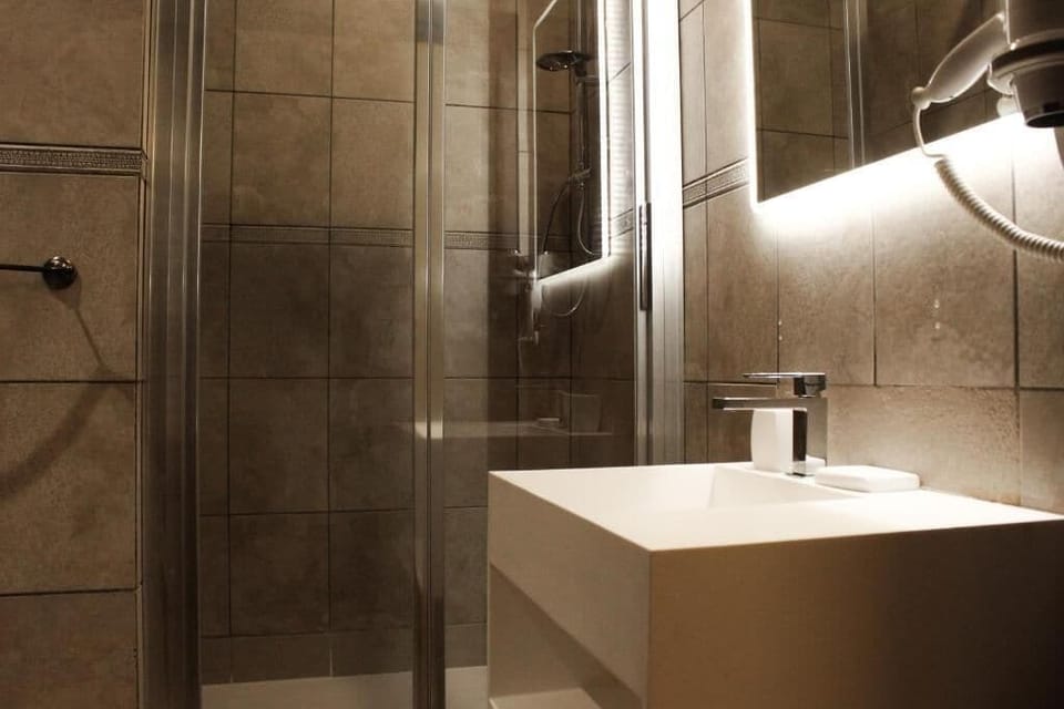 Standard Double Room, River View | Bathroom | Shower, hair dryer, bathrobes, slippers