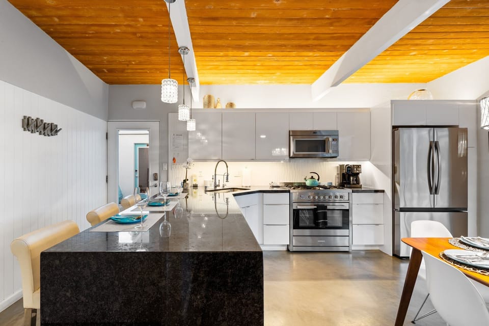 Kitchen is equipped with stainless steel appliances and cooking basics.