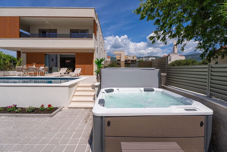  Unwind in the inviting hot tub or soak up the sun on the spacious sun deck
