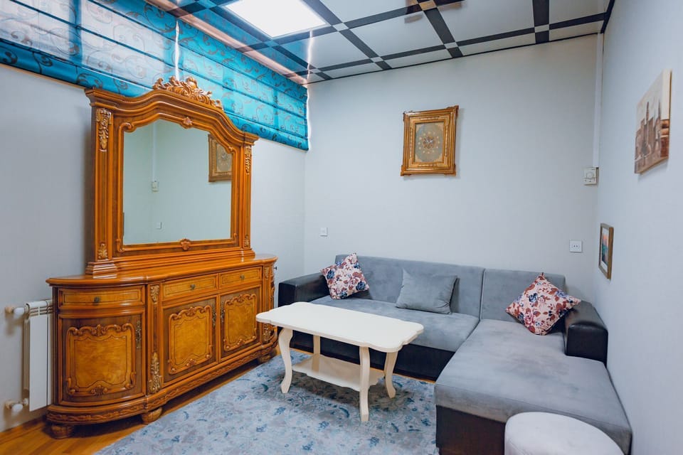 Family Quadruple Room, City View | Living area | Plasma TV