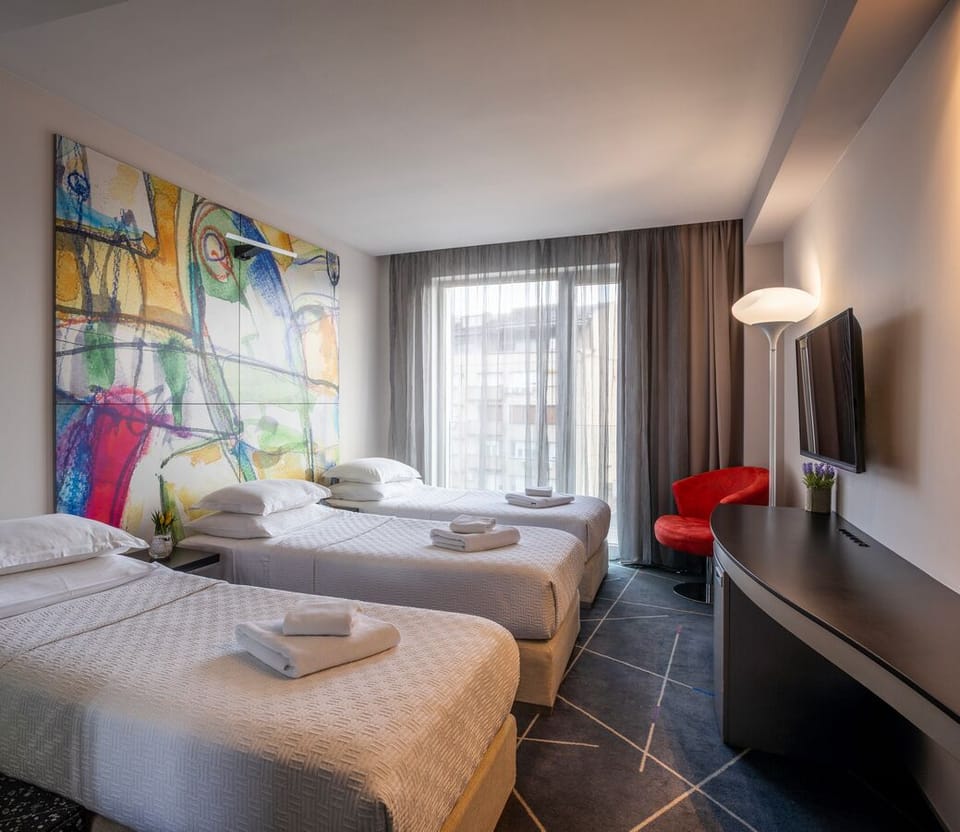 Standard Triple Room | Minibar, desk, laptop workspace, soundproofing