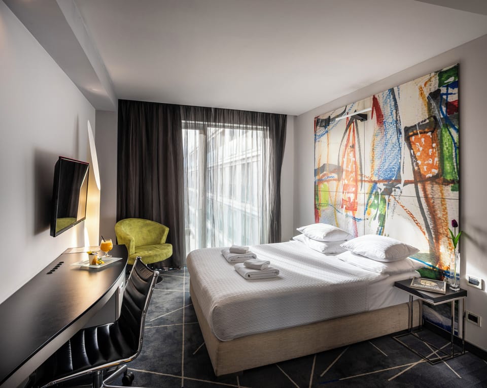 Economy Double Room | Minibar, desk, laptop workspace, soundproofing