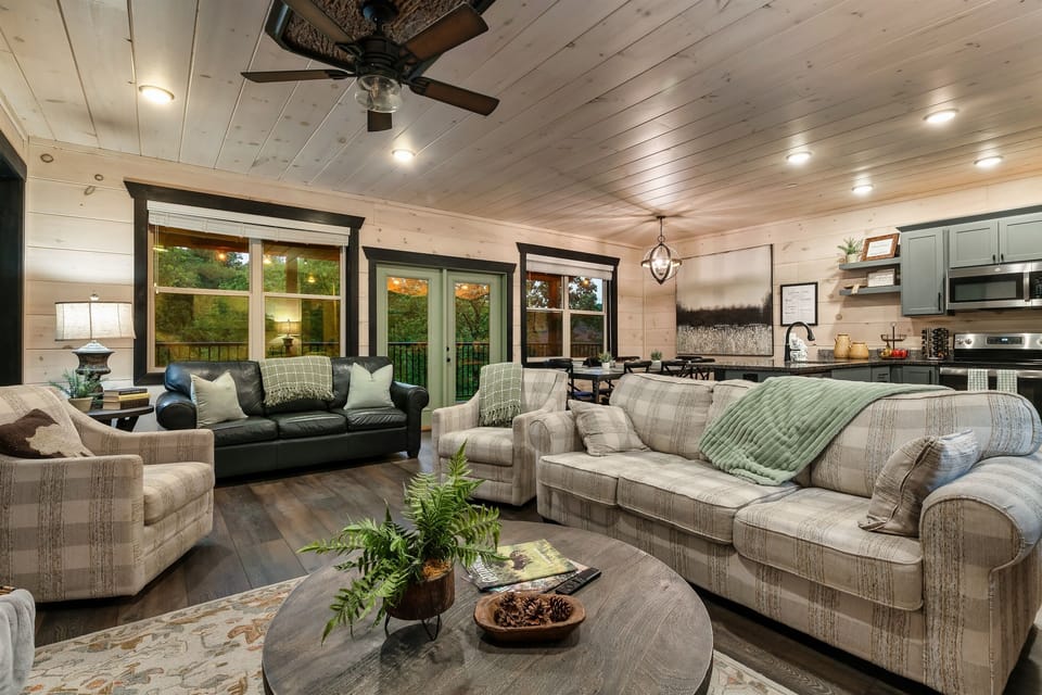 Step from the great room onto a spacious deck nestled among the trees.