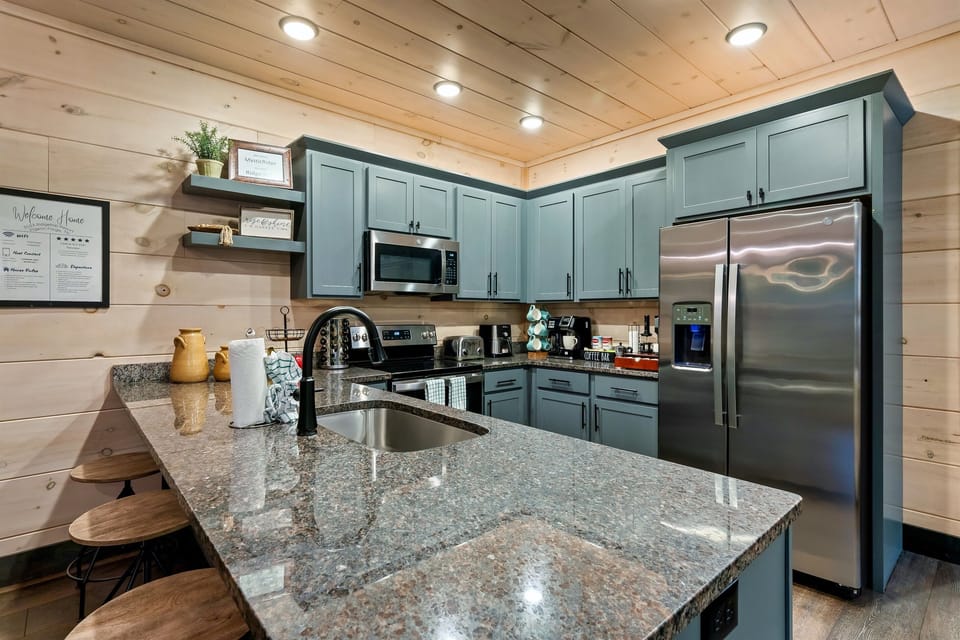 Well-equipped kitchen featuring an air fryer and all the cooking essentials.