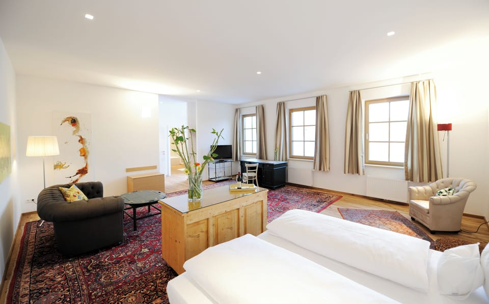 Suite, Balcony, Courtyard View | In-room safe, desk, laptop workspace, soundproofing