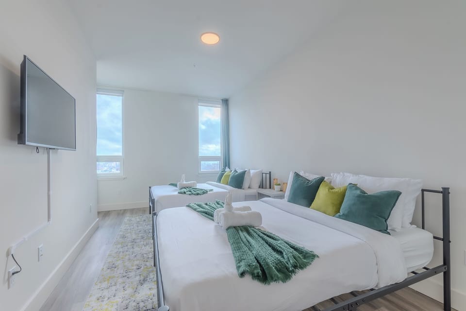 Bedroom with two comfortable beds, ideal for sharing or group stays.