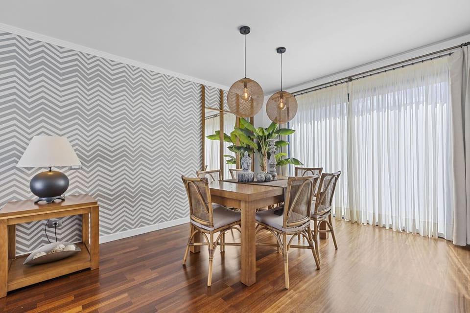 Dining area connected to the living room and kitchen.