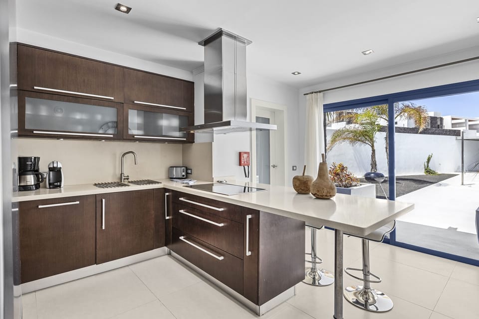 Kitchen island with stools for breakfast.