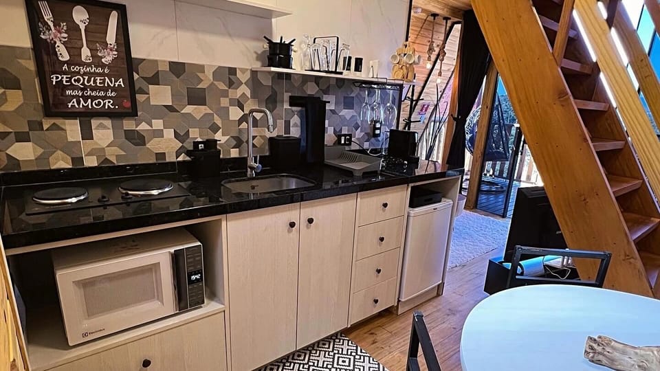 Mini-fridge, microwave, stovetop, cookware/dishes/utensils