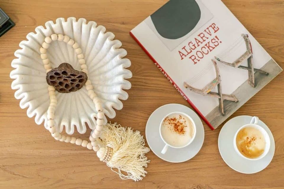 Thoughtful details make this home feel warm and inviting. Enjoy a morning cappuccino with a curated selection of books and decor, inspired by the beauty of the Algarve. Every element is designed to enhance your experience and create relaxation.