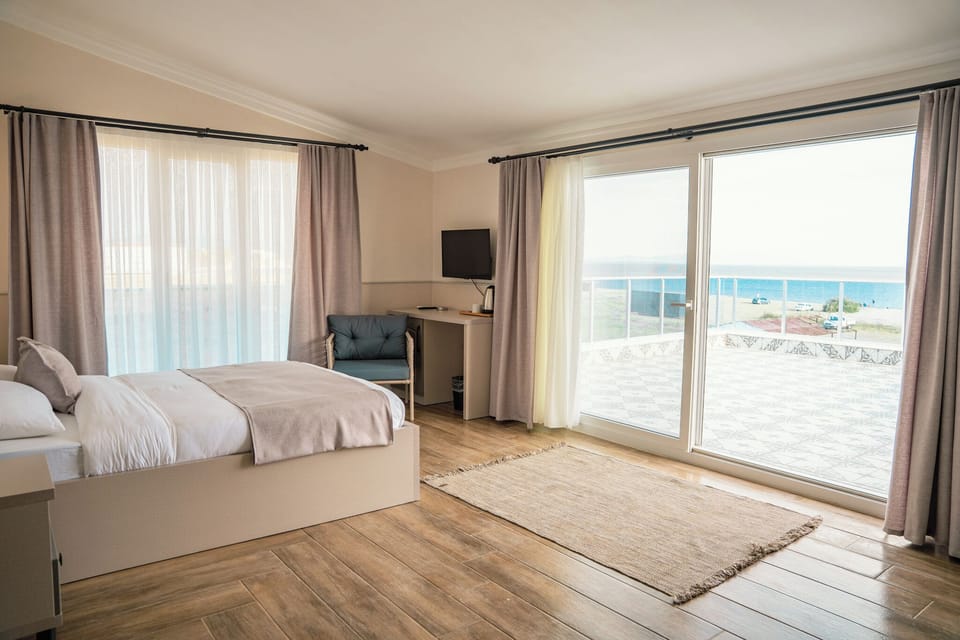 Deluxe Triple Room, Multiple Beds, Terrace, Sea View | Minibar, in-room safe, laptop workspace, soundproofing