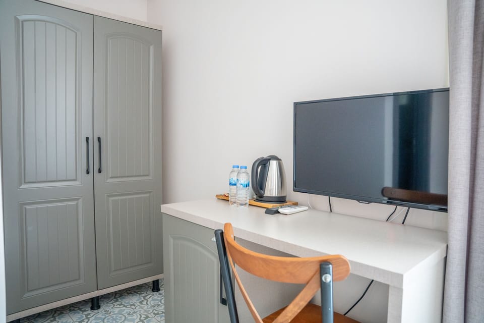 Standard Room, 1 Double Bed, Partial Sea View | Minibar, in-room safe, laptop workspace, soundproofing