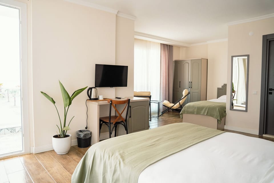 Comfort Room, Multiple Beds, Balcony, Sea View | Minibar, in-room safe, laptop workspace, soundproofing