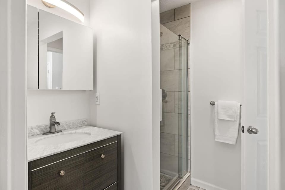 This main floor restroom is accessible via the kitchen and the master bedroom. 
