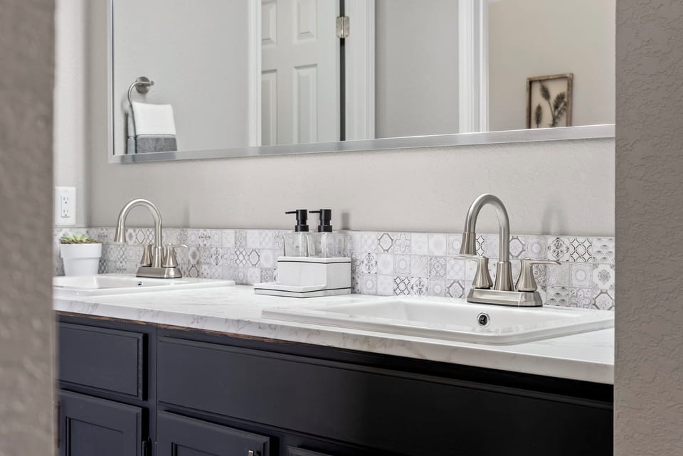 Getting ready is a breeze with the double sinks in your comfortable bathroom.