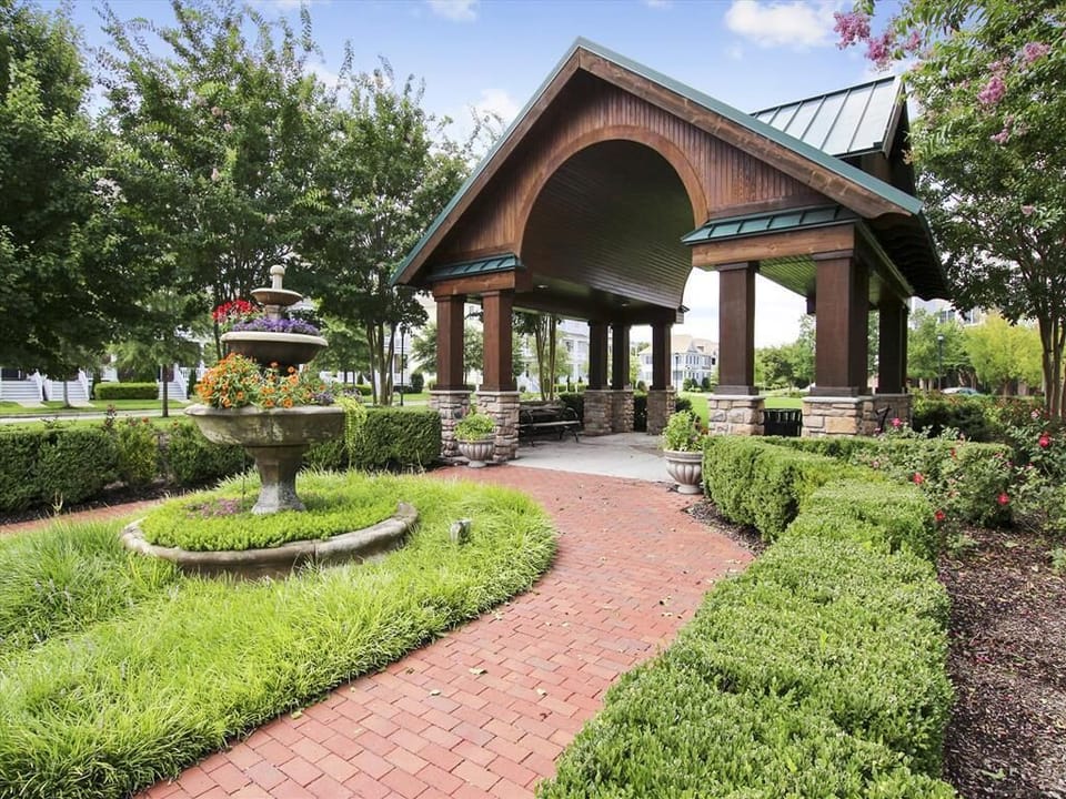 Beautifully landscaped garden leading to a picturesque gazebo, perfect for a peaceful stroll.