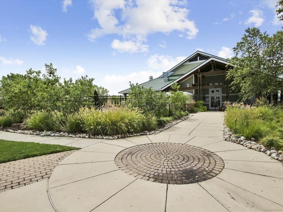 Scenic walking path surrounded by lush greenery, inviting you to explore the serene community.