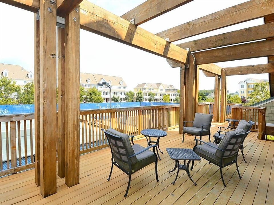 Relaxing outdoor lounge area with comfortable seating and stunning views of the water.