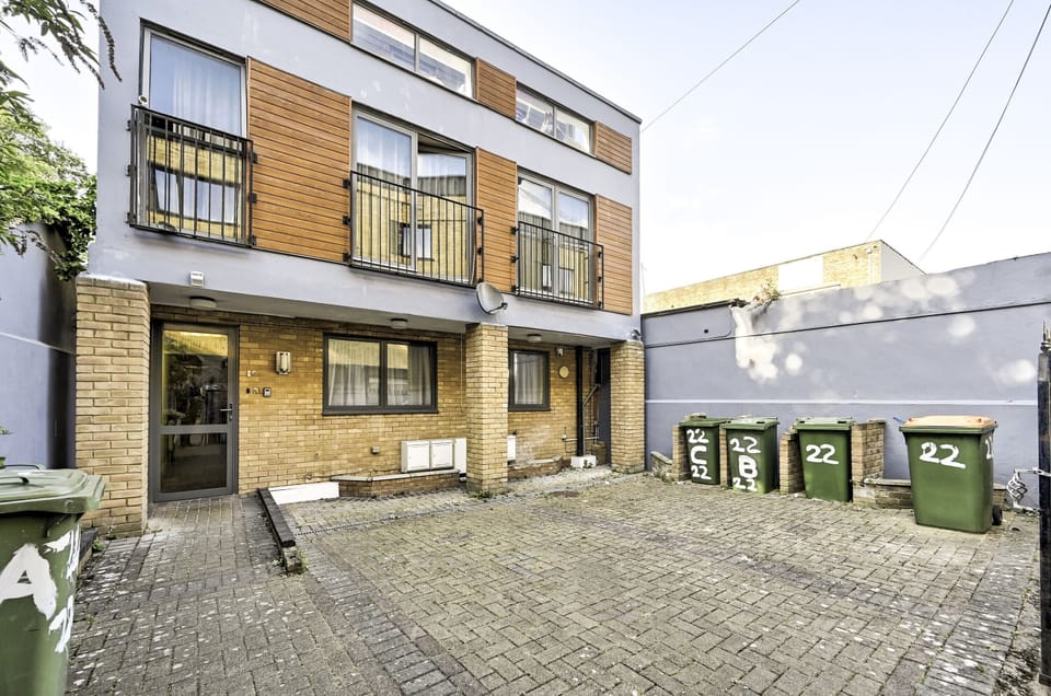 Block-paved forecourt at the front of the building, with free off-street parking on site